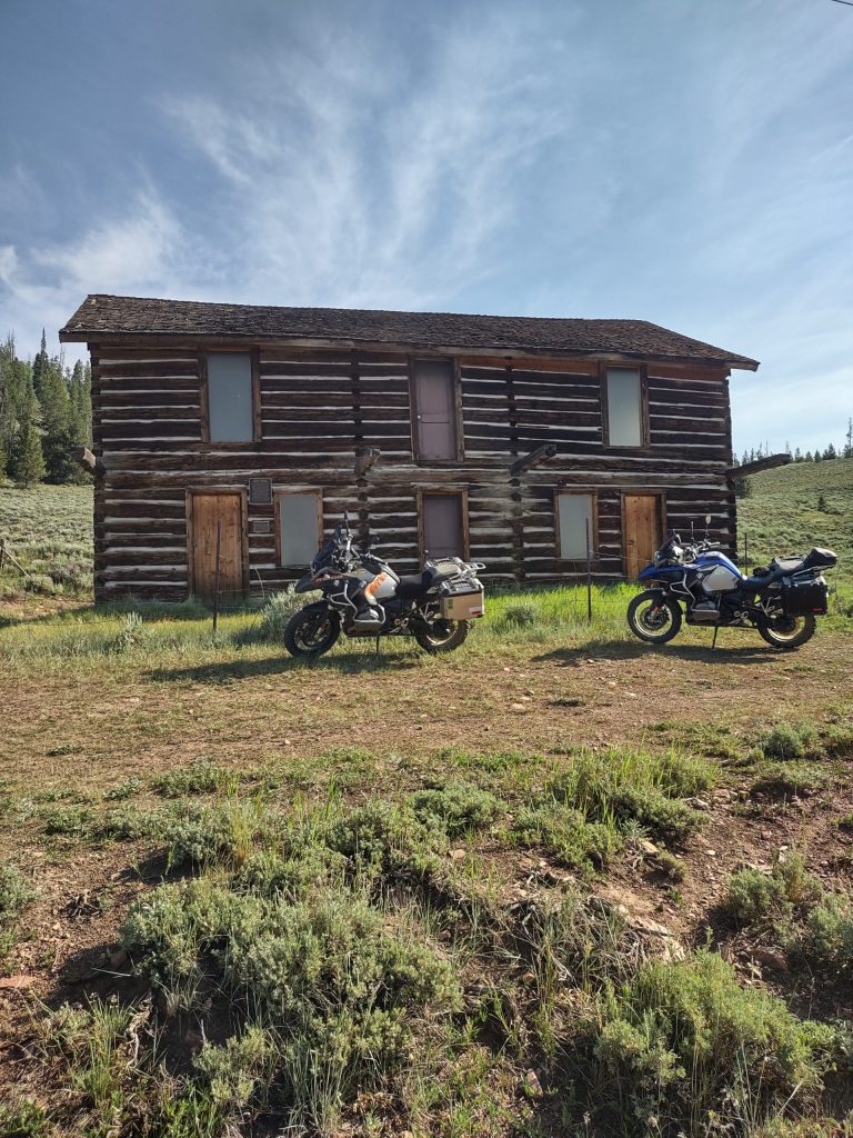 Historic log cabin with adventure bikes